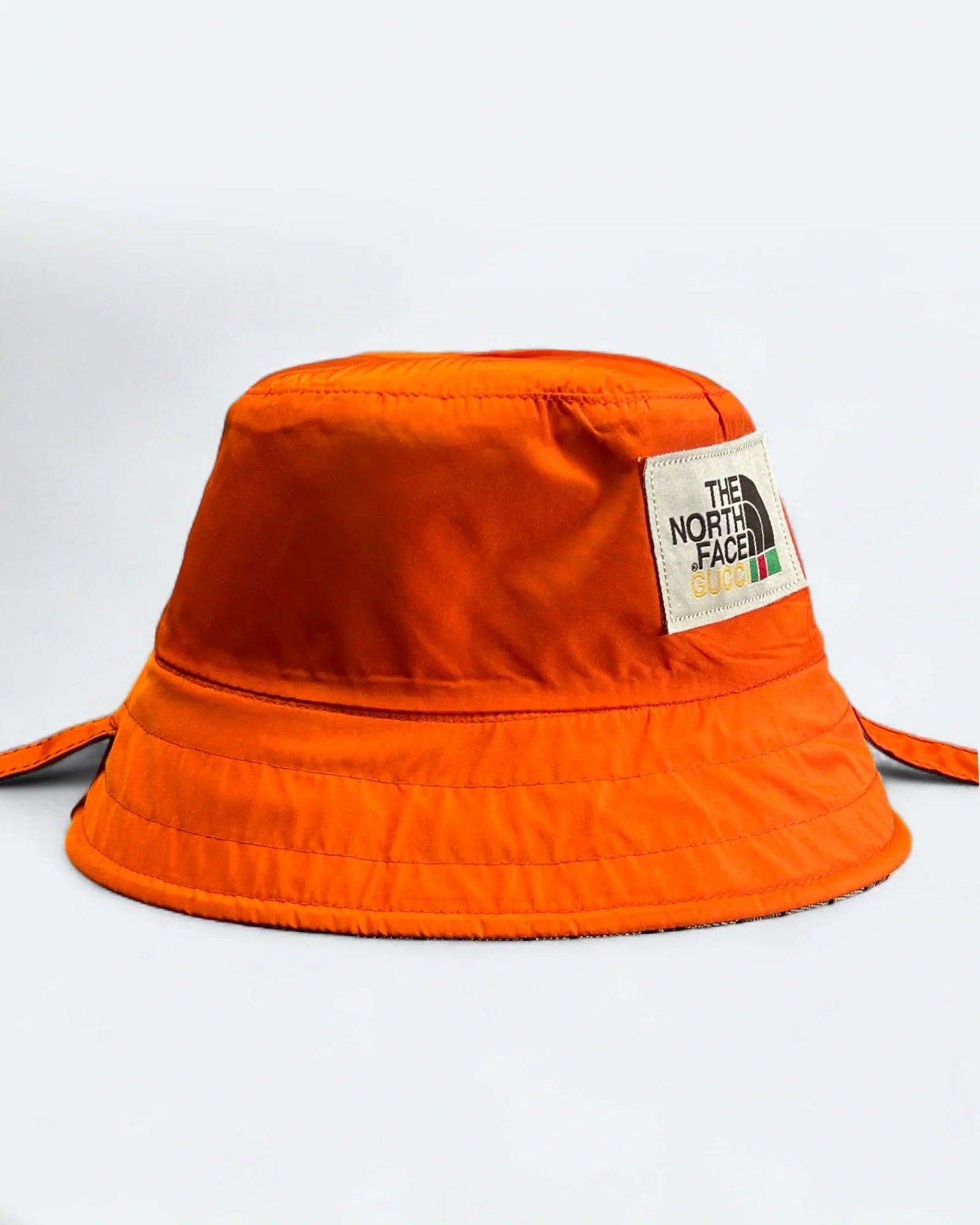GC x The North Face – Oboustranný klobouk typu „bucket hat“ GG – béžová/oranžová
