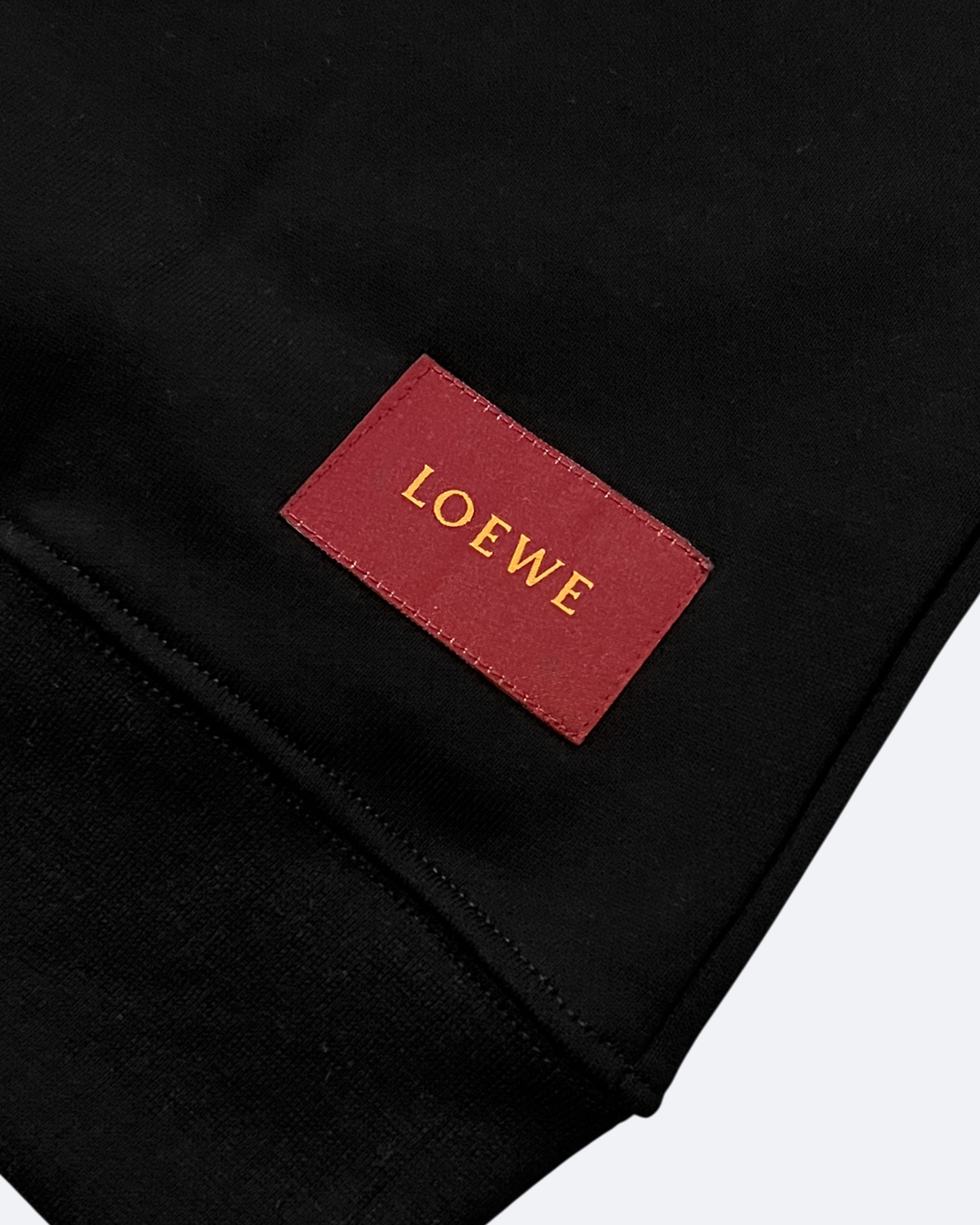 Loewe – mikina s oranžovým kapsovým logem – černá